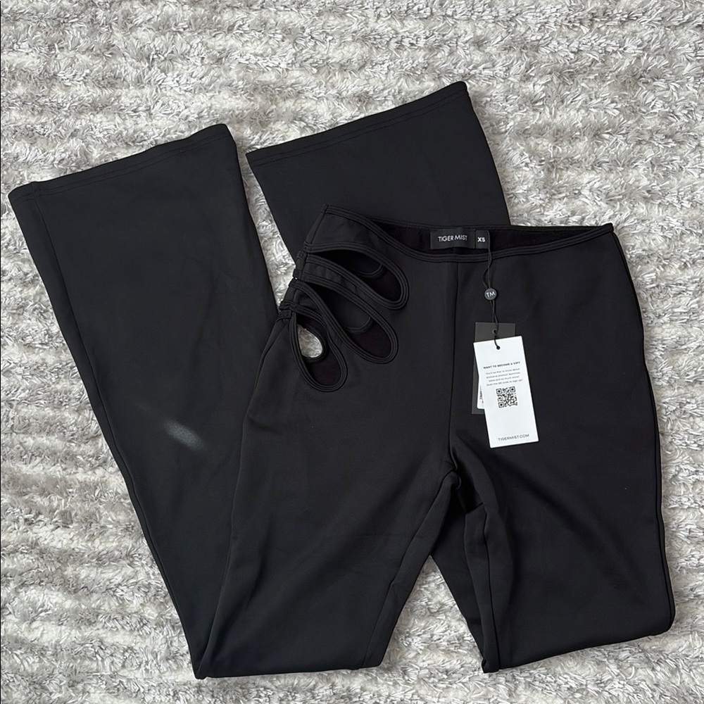 Trendy Black Flare Pants with Cutouts